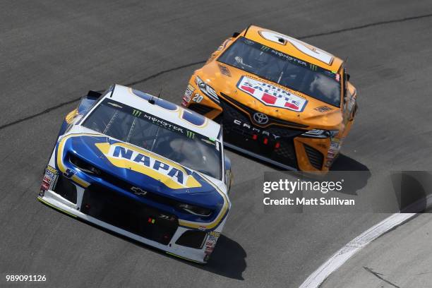 Chase Elliott, driver of the NAPA Auto Parts Chevrolet, leads Erik Jones, driver of the DeWalt Toyota, during the Monster Energy NASCAR Cup Series...