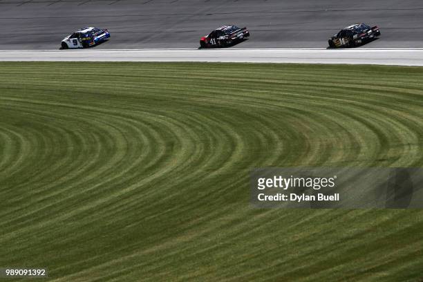 Chase Elliott, driver of the NAPA Auto Parts Chevrolet, leads Kurt Busch, driver of the Haas Automation Ford, and Clint Bowyer, driver of the WIX...