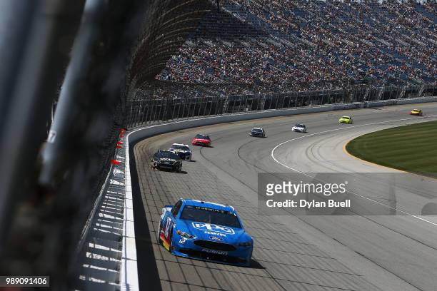 Ryan Blaney, driver of the PPG Ford, leads a pack of cars during the Monster Energy NASCAR Cup Series Overton's 400 at Chicagoland Speedway on July...
