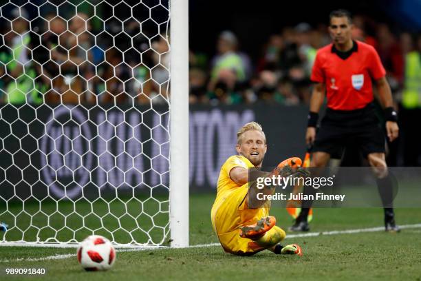 Ivan Rakitic of Croatia scores his team's fifth penalty in the penalty shoot out past Kasper Schmeichel of Denmark during the 2018 FIFA World Cup...