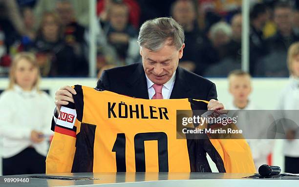 German President Horst Koehler opens the IIHF World Championship group D match between USA and Germany at Veltins Arena on May 7, 2010 in...