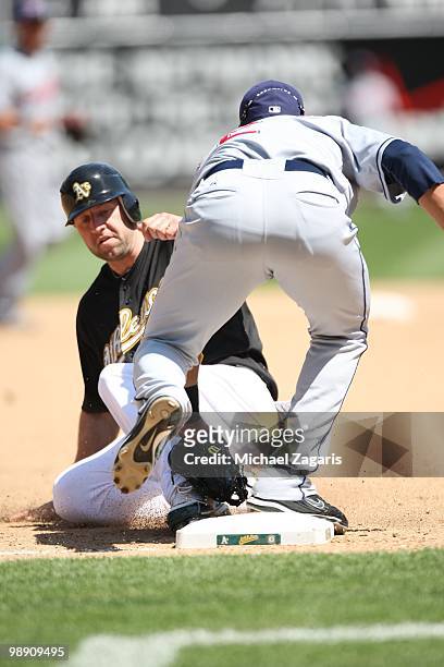 Kevin Kouzmanoff of the Oakland Athletics being tagged out at third during the game against the Cleveland Indians at the Oakland Coliseum on April...
