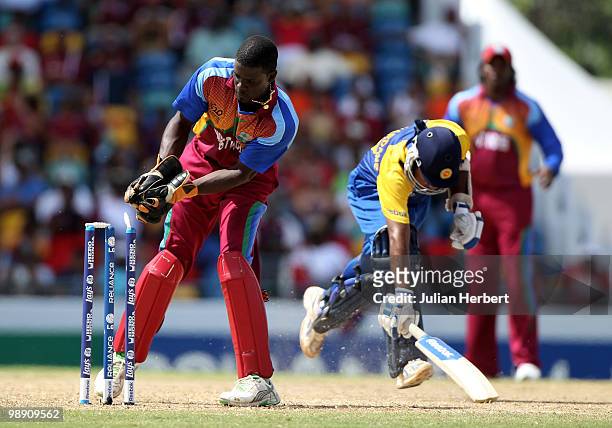 Andre Fletcher of The West Indiesattempts to run out Mahela Jayawardene during The ICC World Twenty20 Super Eight Match between The West Indies and...