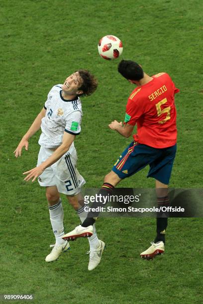 Mario Fernandes of Russia battles with Sergio Busquets of Spain during the 2018 FIFA World Cup Russia Round of 16 match between Spain and Russia at...