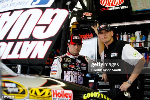 Jeff Gordon , driver of the DuPont/National Guard Facebook Chevrolet speaks with crew chief Steve Letarte during practice for the NASCAR Sprint Cup...