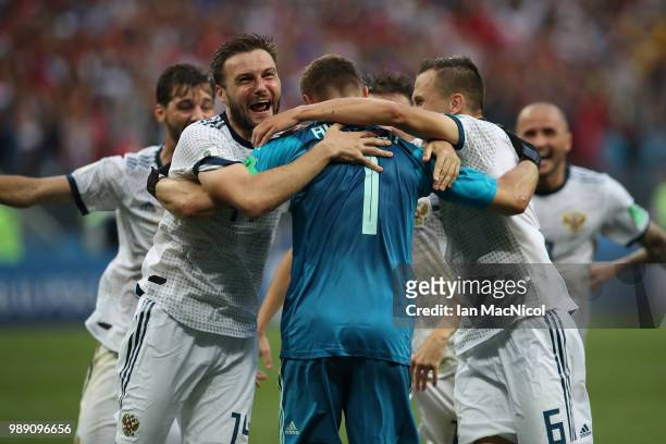 Vladimir Granat of Russia celebrates with goalkeeper Igor Akinfeev of Russia at the end of the penalty shoot out during the 2018 FIFA World Cup...