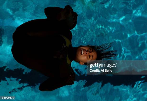 Tammy Tagagi of Brazil dives during the Women's 3 meter springboard preliminaries at the Fort Lauderdale Aquatic Center during Day 2 of the AT&T USA...