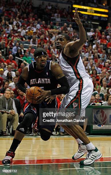 Josh Smith of the Atlanta Hawks drives against Kurt Thomas of the Milwaukee Bucks in Game Six of the Eastern Conference Quarterfinals during the 2010...