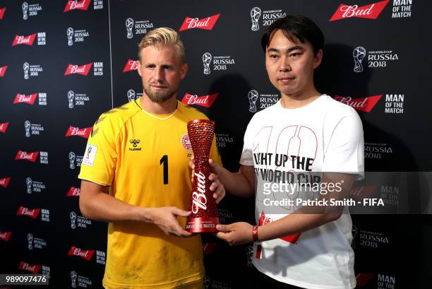 Kasper Schmeichel of Denmark poses with his man of the match trophy following his performance in the 2018 FIFA World Cup Russia Round of 16 match...