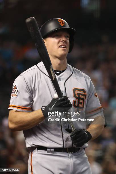 Nick Hundley of the San Francisco Giants warms up on deck during the second inning of the MLB game against the Arizona Diamondbacks at Chase Field on...