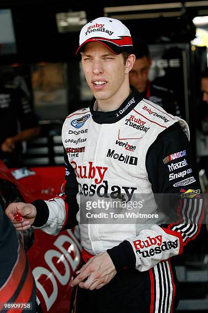 Brad Keselowski, driver of the Penske Dodge, waits in the garage during practice for the NASCAR Sprint Cup Series SHOWTIME Southern 500 at Darlington...