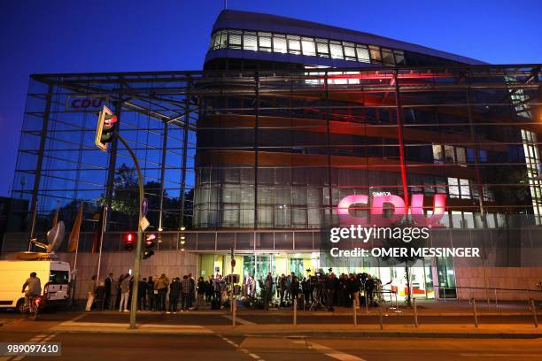 Members of the press wait outside the Christian Democratic Union headquarters in Berlin during a party leadership meeting, on July 1, 2018. -...