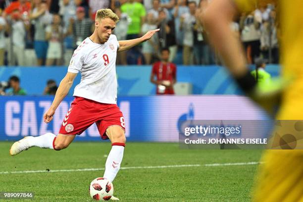 Denmark's forward Nicolai Jorgensen fails to score in the penalty shoot-out at the end of the Russia 2018 World Cup round of 16 football match...