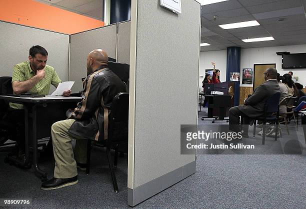 Vince Fortunato interviews a job applicant during a hiring event at the Career Link Center One Stop job center May 7, 2010 in San Francisco,...