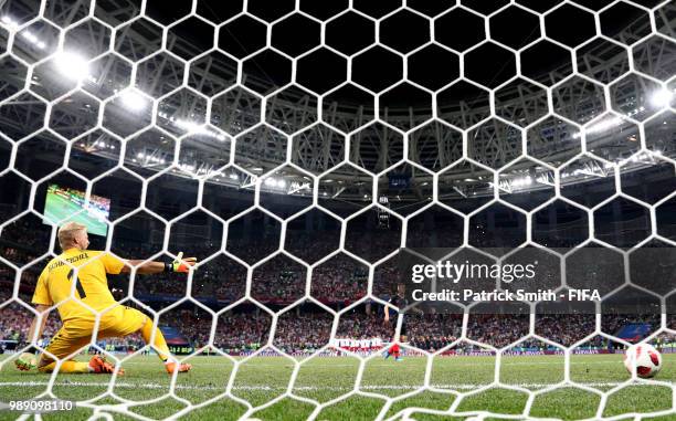 Andrej Kramaric of Croatia scores his team's second penalty in the penalty shoot out past Kasper Schmeichel of Denmark during the 2018 FIFA World Cup...
