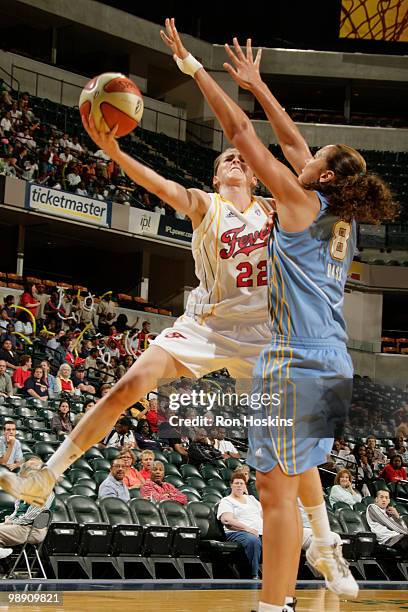 Allie Quigley of the Indiana Fever shoots over Mistie Bass of the Chicago Sky at Conseco Fieldhouse on May 7, 2010 in Indianapolis, Indiana. The...