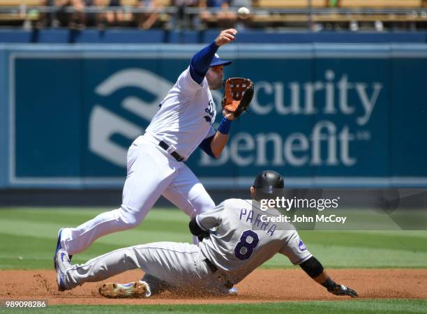Max Muncy of the Los Angeles Dodgers catches Gerardo Parra of the Colorado Rockies in a double play in the first inning at Dodger Stadium on July 1,...