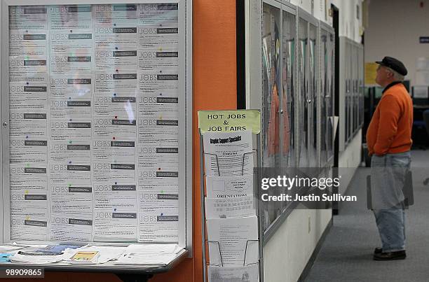 Job seeker looks at job listings posted on bulletin boards at the Career Link Center One Stop job center May 7, 2010 in San Francisco, California. A...