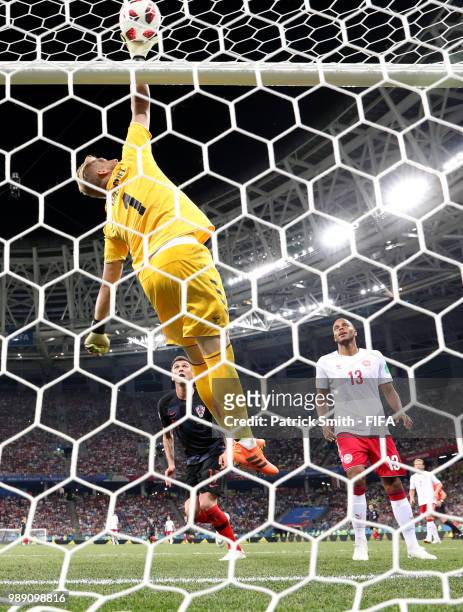 Kasper Schmeichel of Denmark defletcs the ball over the bar during the 2018 FIFA World Cup Russia Round of 16 match between Croatia and Denmark at...