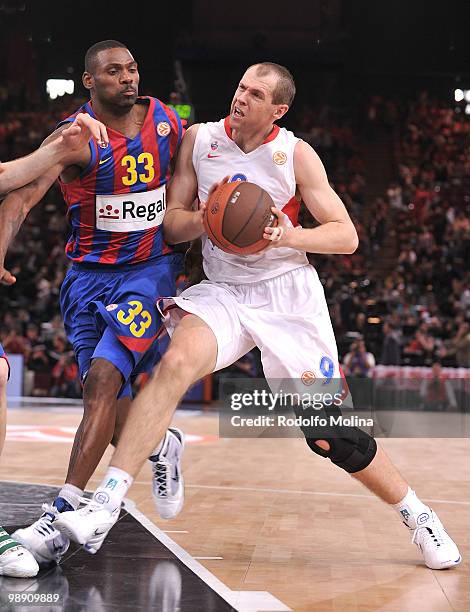 Ramunas Siskauskas, #9 of CSKA Moscow competes with Pete Mickeal, #33 of Regal FC Barcelona during the Euroleague Basketball Senifinal 1 between...