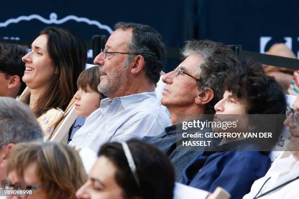 President of the Arab World Institute in Paris and former French Culture minister Jack Lang , his wife Monique Buczynski and French actor Jean Reno...