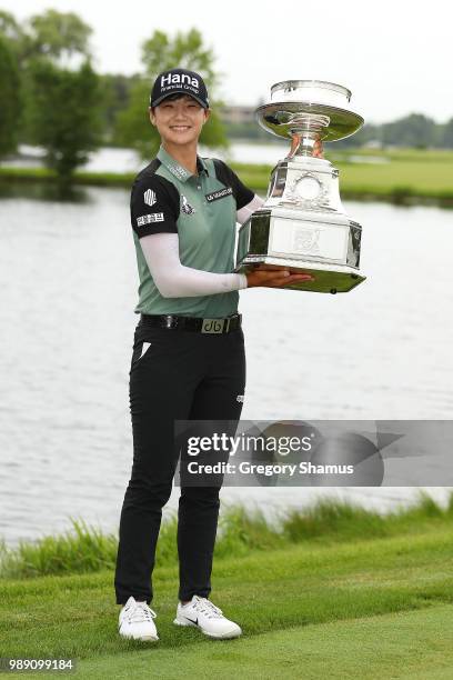 Sung Hyun Park of Korea poses with the championship trophy after winning the 2018 KPMG PGA Championship at Kemper Lakes Golf Club on July 1, 2018 in...