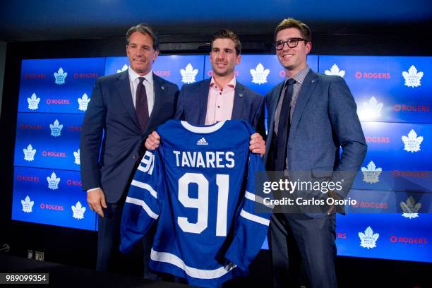 Maple Leafs president Brendan Shanahan, John Tavares and Leafs general manager Kyle Dubas pose for a photo during the announcement. The Toronto Maple...