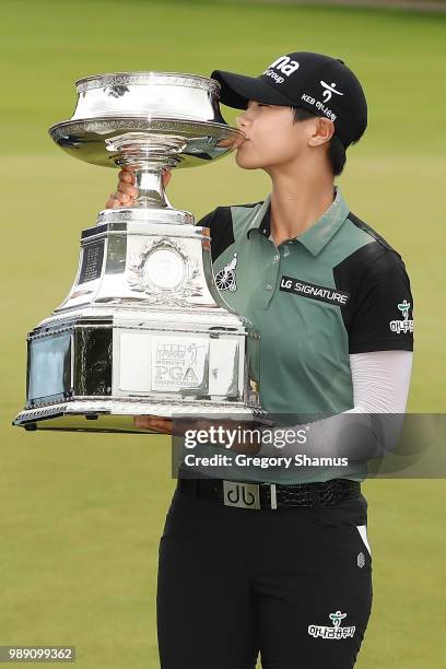 Sung Hyun Park of Korea kisses the championship trophy after winning the 2018 KPMG PGA Championship at Kemper Lakes Golf Club on July 1, 2018 in...