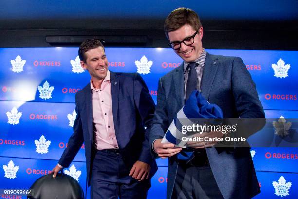 John Tavares and general manager Kyle Dubas smile during the press conference. The Toronto Maple Leafs have signed John Tavares for seven years, $77...