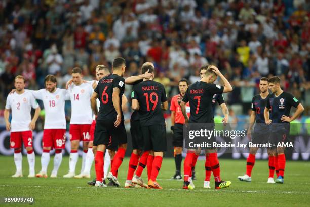 Milan Badelj of Croatia is consoled after missing during a penalty shootout during the 2018 FIFA World Cup Russia Round of 16 match between Croatia...