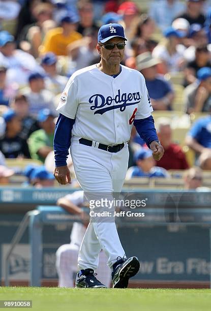 Los Angeles Dodgers manager Joe Torre walks out to the pitchers mound against the San Francisco Giants at Dodger Stadium on April 18, 2010 in Los...