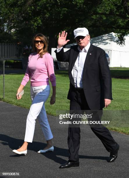 President Donald Trump and first lady Melania Trump cross the South Lawn upon arrival at the White House on July 1, 2018 in Washington, DC. - The...