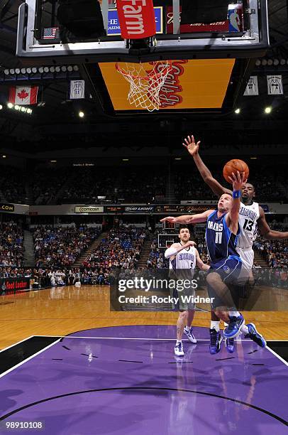 Jose Barea of the Dallas Mavericks drives to the basket for a layup against Tyreke Evans of the Sacramento Kings during the game at Arco Arena on...