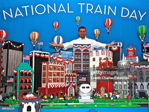 "Cake Boss" Buddy Valastro and his National Train Day cake attend Amtrak's National Train Day celebration at Penn Station on May 7, 2010 in New York...