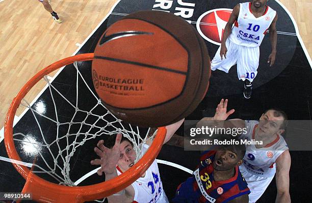 Sasha Kaun, #24 of CSKA Moscow competes with Pete Mickeal, #33 of Regal FC Barcelona during the Euroleague Basketball Senifinal 1 between Regal FC...