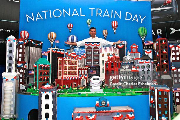 "Cake Boss" Buddy Valastro and his National Train Day cake attend Amtrak's National Train Day celebration at Penn Station on May 7, 2010 in New York...