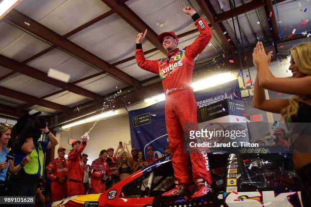 Kyle Busch, driver of the Skittles Red White & Blue Toyota, celebrates after winning the Monster Energy NASCAR Cup Series Overton's 400 at...
