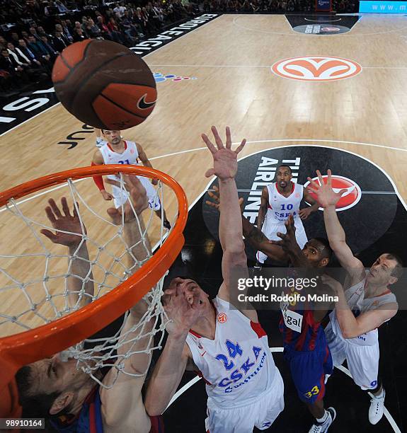 Sasha Kaun, #24 of CSKA Moscow competes with Pete Mickeal, #33 of Regal FC Barcelona during the Euroleague Basketball Senifinal 1 between Regal FC...