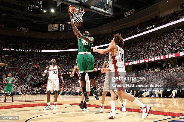 Kendrick Perkins of the Boston Celtics lays the ball up over Anderson Varejao of the Cleveland Cavaliers in Game Two of the Eastern Conference...