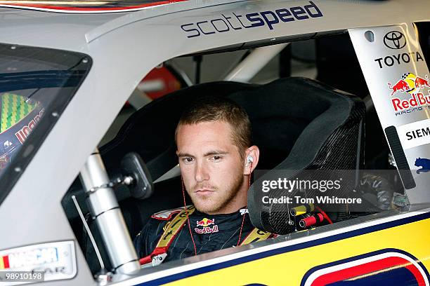 Scott Speed, driver of the Red Bull Toyota sits in his car during practice for the NASCAR Sprint Cup Series SHOWTIME Southern 500 at Darlington...