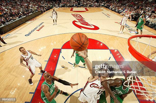 Anderson Varejao of the Cleveland Cavaliers goes after a loose ball over Ray Allen and Kevin Garnett of the Boston Celtics in Game One of the Eastern...