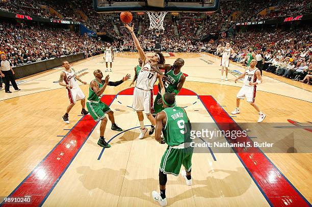 Anderson Varejao of the Cleveland Cavaliers goes after a loose ball over Ray Allen and Kevin Garnett of the Boston Celtics in Game One of the Eastern...