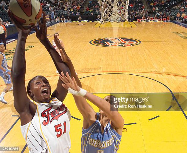 Josephine Owino of the Indiana Fever shoots over Mistie Bass of the Chicago Sky at Conseco Fieldhouse on May 7, 2010 in Indianapolis, Indiana. NOTE...