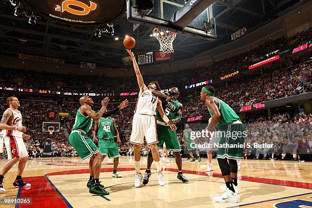 Anderson Varejao of the Cleveland Cavaliers goes after a loose ball over Ray Allen and Kevin Garnett of the Boston Celtics in Game One of the Eastern...