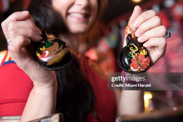 Gisselle Riestra-Vidal shows off her castanets at Tapas and Tintos, a restaurant in Miami Beach, Fla. Where fans gathered to watch Spain take on...