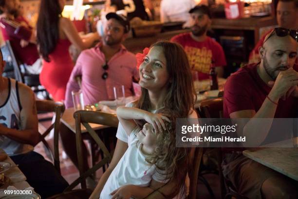 Yazmine Marimon and her daughter, Juliette Delauany watch a soccer match at Tapas and Tintos, a restaurant in Miami Beach, Fla. Where fans gathered...