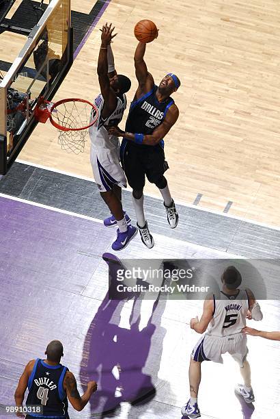Erick Dampier of the Dallas Mavericks rebounds against Jason Thompson of the Sacramento Kings during the game at Arco Arena on April 10, 2010 in...