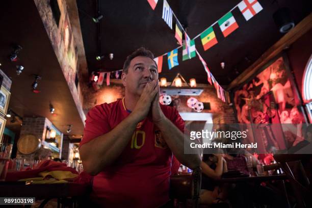 Juan Carlos Muniz watches a soccer match at Tapas and Tintos, a restaurant in Miami Beach, Fla. Where fans gathered to watch Spain take on Russia...