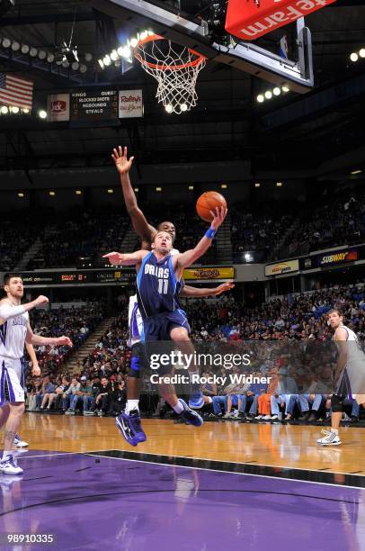 Jose Barea of the Dallas Mavericks shoots a layup against Tyreke Evans of the Sacramento Kings during the game at Arco Arena on April 10, 2010 in...
