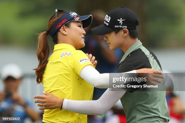 Sung Hyun Park of Korea hugs So Yeon Ryu of Korea after making a birdie putt to beat her on the second playoff hole to win the 2018 KPMG PGA...